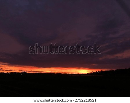 A dramatic sunset painting the sky. Some endings are beautifully loud.