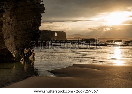 Dramatic Sunset at Playa de las Catedrales: Iconic Rock Formations and Golden Hour Light