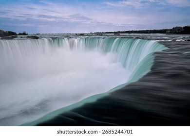 Dramatic Sunset, Rainbow, and Mist over the Majestic Horseshoe Falls of Niagara