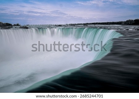 Dramatic Sunset, Rainbow, and Mist over the Majestic Horseshoe Falls of Niagara