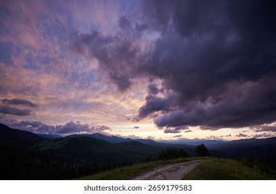 Dramatic sunset scene with dark, brooding clouds casting shadows over sky. Horizon glows with warm hues of orange and pink, contrasting against silhouettes of mountains, creating moody atmosphere.