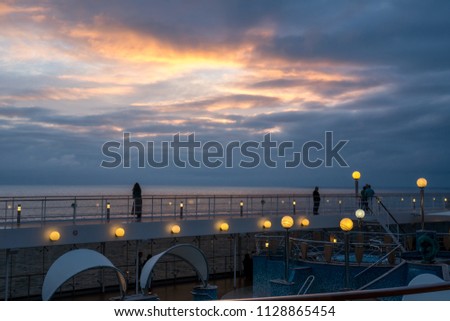 dramatic sunset seen from a cruiseship over the ocean water