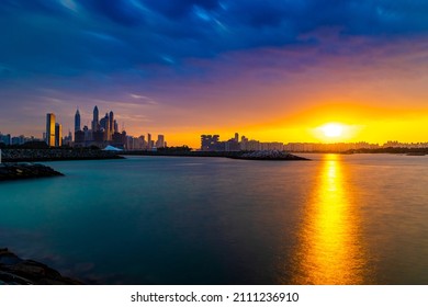 Dramatic Sunset Sky With Clouds. Beautiful Sunset Over The Arabian Sea In Dubai Marina UAE. Nature And Beauty Concept. Orange Sundown. Long Exposure Shot.