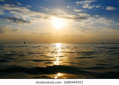Dramatic sunset sky with clouds. Dramatic sunset over the sea blur