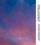 Dramatic sunset sky with colorful clouds background concept. Evening sunset. Beautiful red and orange twilight sky.