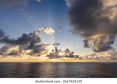 Dramatic sunset sky with colorful clouds over the Pacific Ocean near Hawaii.