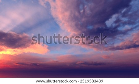 Dramatic sunset sky. A combination of orange, blue and purple. You can see rays of light from the sun.