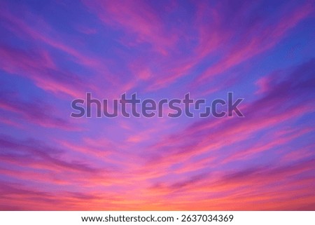 Dramatic sunset sky filled with vibrant pink and purple streaks - Radiant evening sky painted with bold magenta and violet clouds