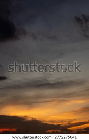 Dramatic Sunset Sky with Orange and Grey Clouds