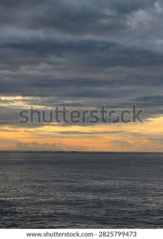 Dramatic Sunset Sky Over Calm Ocean Horizon
