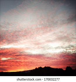 Dramatic sunset in sky over landscape
