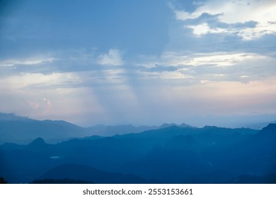 Dramatic sunset sky over mountain range nature landscape evening view serene environment atmospheric beauty