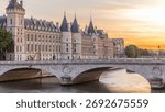 Dramatic sunset sky over river Seine and Conciergerie timelapse in Paris, France, with boats and Pont Neuf. Colorful background. Romantic cityscape.