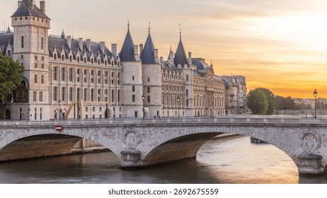 Dramatic sunset sky over river Seine and Conciergerie timelapse in Paris, France, with boats and Pont Neuf. Colorful background. Romantic cityscape.