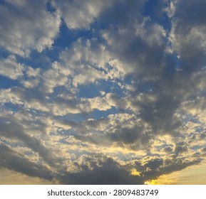 Dramatic sunset sky texture with golden crepuscular rays