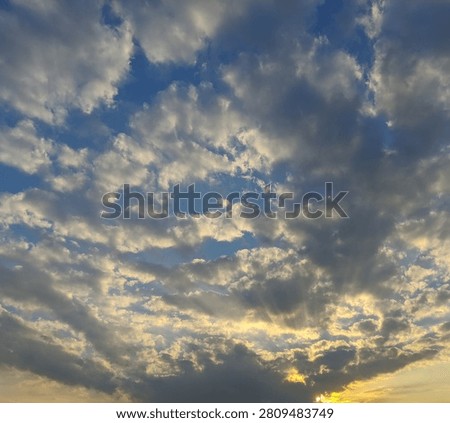 Dramatic sunset sky texture with golden crepuscular rays