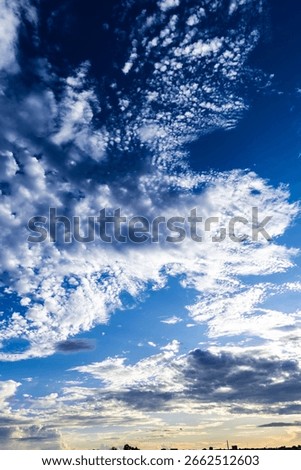 Dramatic sunset in the Sky through cumulus storm clouds,. Awesome epic landscape. Amazing vibrant colors, in Brazil