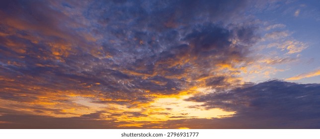Dramatic sunset sky with vibrant orange and purple clouds,A stunning view of the sky during sunset, featuring a dramatic formation of clouds illuminated by vibrant shades of orange, yellow, and deep purple, creating a breathtaking and peaceful atmosphere.