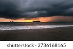 Dramatic sunset and storm at the beach Playa Espadilla and Manuel Antonio near Manuel Antonio Nature Reserve in Costa Rica