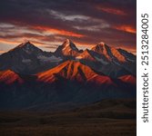 A dramatic sunset with the sun setting behind jagged mountain peaks, casting long shadows across the landscape. The sky is painted with deep reds, fiery oranges, and soft purples.