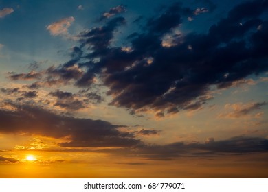 Dramatic Sunset Sunrise Sky With Dark Blue Clouds