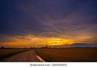 Dramatic sunset thunderstorm sky over an open field - Powered by Shutterstock