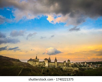 Dramatic sunset view on the castle in Kamianets-Podilskyi in spring.