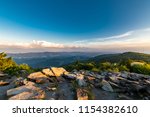 A dramatic sunset viewed from Spruce Knob West Virginia in the Appalachian Mountains looking down on hills in the surrounding valleys