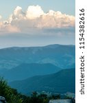 A dramatic sunset viewed from Spruce Knob West Virginia in the Appalachian Mountains looking down on hills in the surrounding valleys