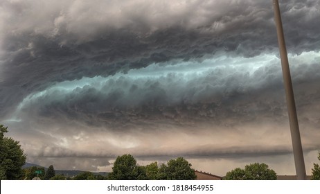 Dramatic supercell cloud formation over town