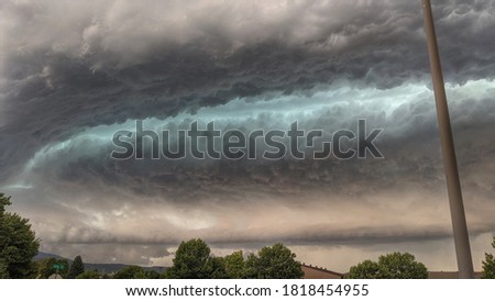 Dramatic supercell cloud formation over town