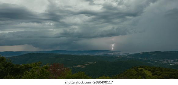 Dramatic supercell thunderstorm with lightning flashes over the Gulf of Trieste, Italy