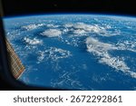 Dramatic swirling cloud formation over the ocean from an elevated perspective. Earth from space, a stunning view of our planet. Earth atmosphere. Elements of this image furnished by NASA