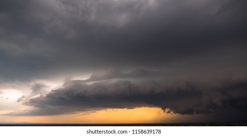 Dramatic thunder storm clouds at dark sky