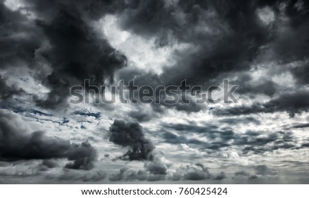 Dramatic thunderstorm clouds background at dark sky