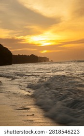 Dramatic twilight sky over the ocean horizon during sunset at a rocky beach coast in Bali.
Stunning dramatic red and orange sunset sky over the ocean horizon in Bali, Indonesia.
Beautiful tropical golden hour sunset view from a coastal cliff overlooking the sea waves.