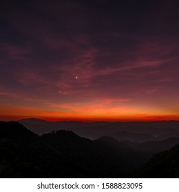 dramatic twilight winter sky with Venus star over mountains landscape 