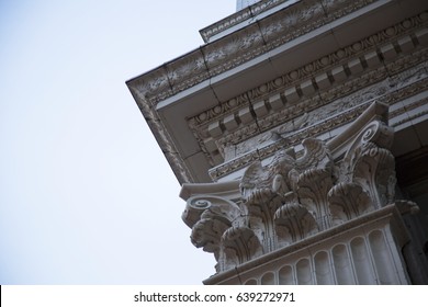 Dramatic Upward Skyward Angled View, Corner Of Ornate Building, Architectural, Dentil Trim, Ball And Dart Frieze, Eagle, Corinthian Columns, Shells, Leafs, Daytime - West Coast, USA