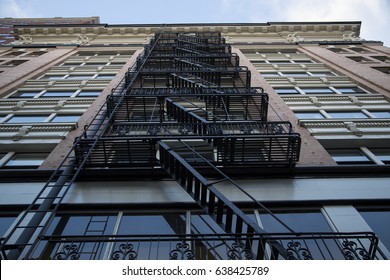 Dramatic Upward Skyward View, Tall City Building, Brick Front, Black Fire Escape/Stairs, Daytime - Portland, Oregon