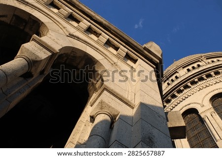 Dramatic upward view along the arches and dome of Sacre-Coeur, Paris
