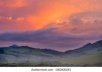 Dramatic Vibrant Sunrise over Misty Hills on a Summer Morning, Altai Mountains, Kazakhstan.  Fantasyland, New Day, Traveling, Blue Hour Concept