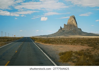 Dramatic view of Agathla Peak, a old Volcanic neck, while Driving to Monument Valley Arizona
