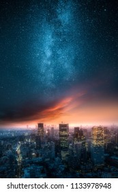 Dramatic View Of A City Skyline At Night With Red Clouds Painted By Setting Sun And Beautiful Milky Way Up On The Sky