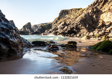 A dramatic view of  Cornish beach of the Bedruthan steps during the low tide. Carnewas, North Atlantic coast of Cornwall. South West England, United Kingdom. UK