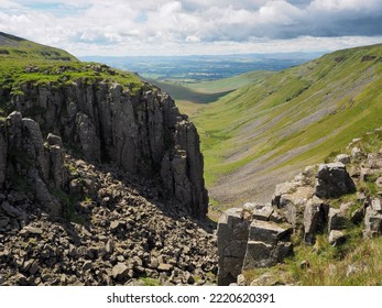 Dramatic view from the edge of High Cup Nick down the High Cup Gill chasm, Eden Valley, North Pennines, Cumbria, UK - Shutterstock ID 2220620391