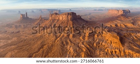 Dramatic view of the Monument Valley's magnificent butte and mittens lit up during a sunset.
Iconic butte, spire and mitten formations used as a backdrop in many old western movies. Navajo,Arizona.