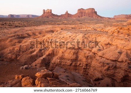 Dramatic view of the Monument Valley's magnificent butte and mittens lit up during a sunset.
Iconic butte, spire and mitten formations used as a backdrop in many old western movies. Navajo,Arizona.