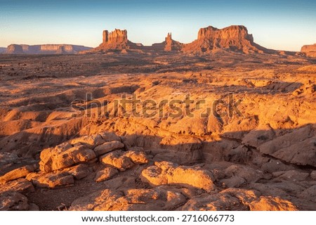Dramatic view of the Monument Valley's magnificent butte and mittens lit up during a sunset.
Iconic butte, spire and mitten formations used as a backdrop in many old western movies. Navajo,Arizona.