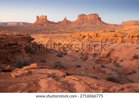 Dramatic view of the Monument Valley's magnificent butte and mittens lit up during a sunset.
Iconic butte, spire and mitten formations used as a backdrop in many old western movies. Navajo,Arizona.