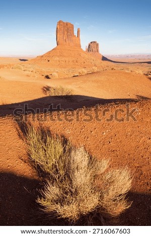 Dramatic view of the Monument Valley's magnificent butte and mittens lit up during a sunset.
Iconic butte, spire and mitten formations used as a backdrop in many old western movies.

